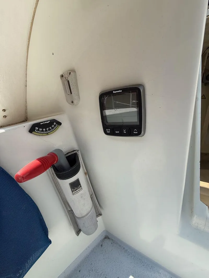 Slide: The Image of Interior of 2006 Mas Mini Transat 6.50 with navigation equipment and tool holder. - 37