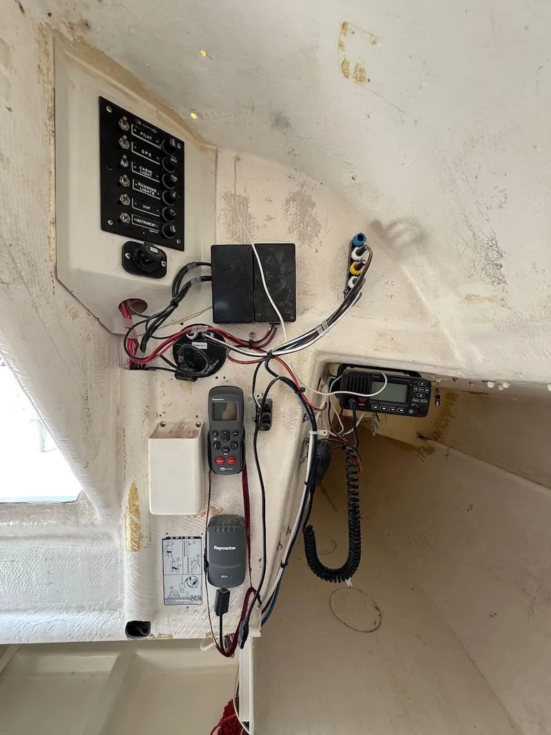 Slide: The Image of Interior of 2006 Mas Mini Transat 6.50 showing navigation and communication equipment. - 39