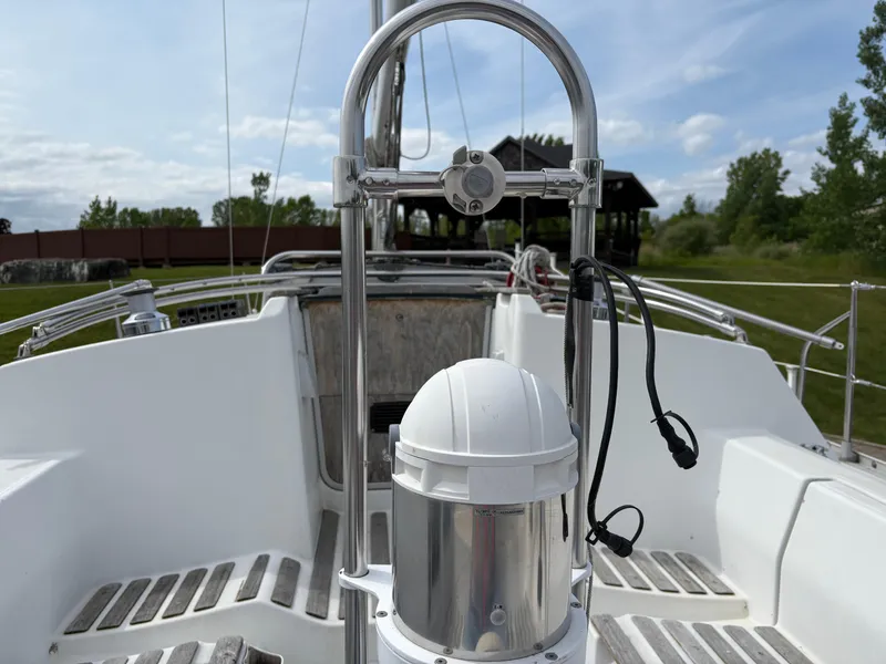 Slide: The Image of Cockpit view of a 1989 Beneteau 32s5 sailboat with steering wheel and equipment. - 10