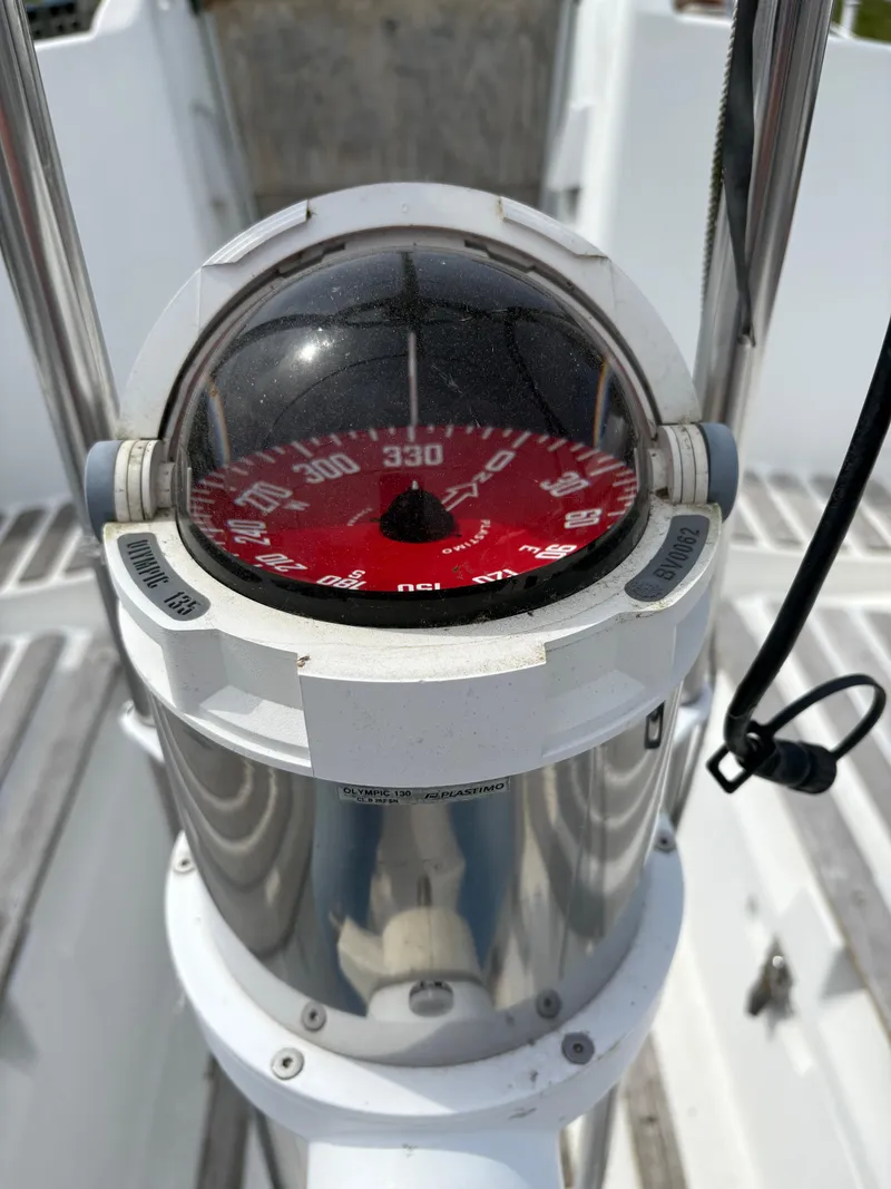 Slide: The Image of Compass on 1989 Beneteau 32s5 sailboat, showing heading of 330 degrees. - 13