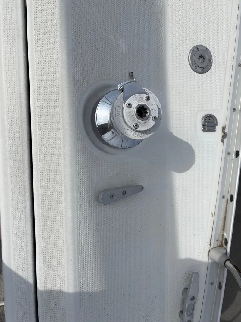 Slide: The Image of Close-up of a 1989 Beneteau 32s5 sailboat winch and deck fittings. - 16