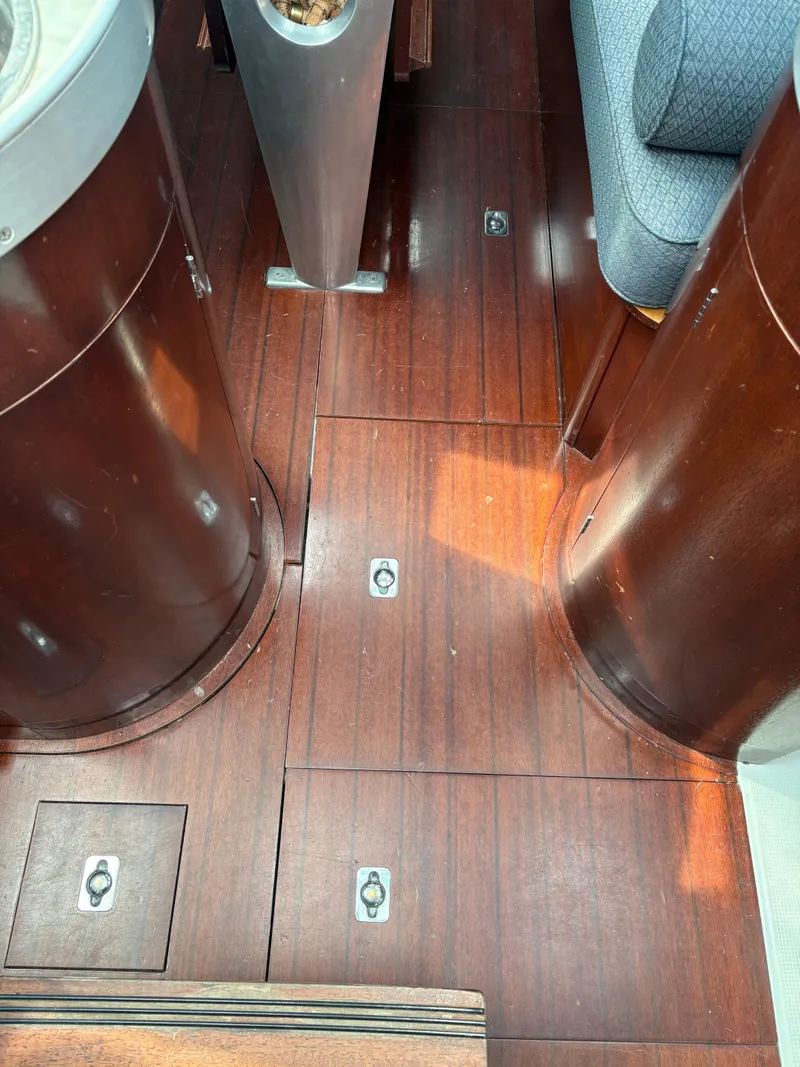 Slide: The Image of Interior view of 1989 Beneteau 32s5 sailboat with polished wooden flooring. - 29
