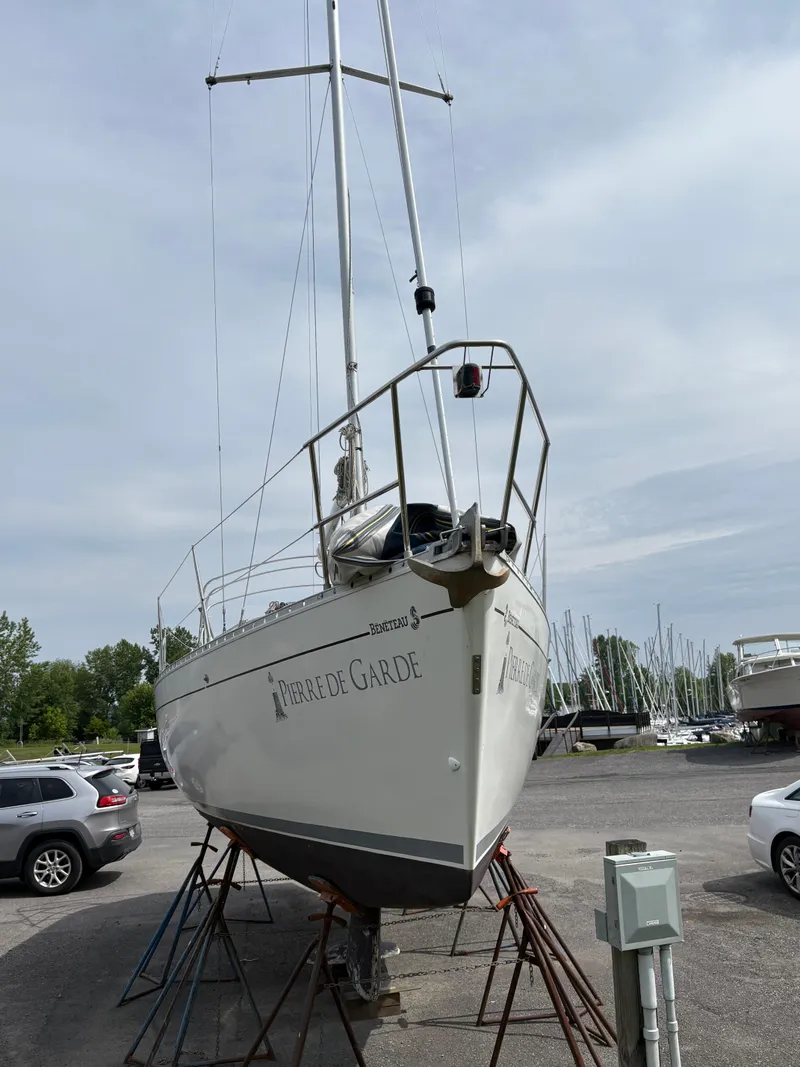 Slide: The Image of 1989 Beneteau 32s5 sailboat on stands in a marina parking lot. - 3