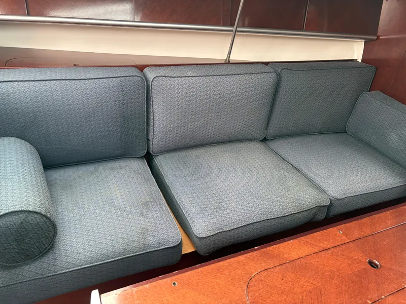 Slide: The Image of Blue cushioned seating in 1989 Beneteau 32s5 sailboat interior. - 30