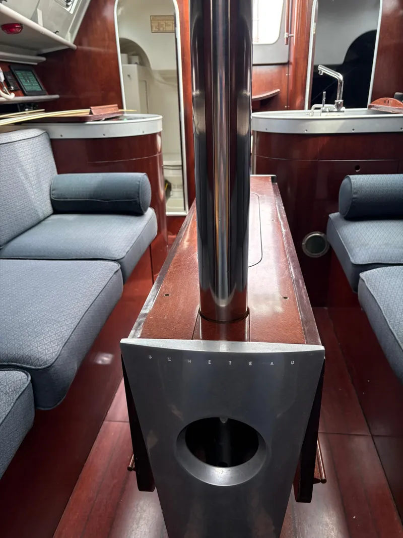 Slide: The Image of Interior of a 1989 Beneteau 32s5 sailboat with wood and blue upholstery. - 32