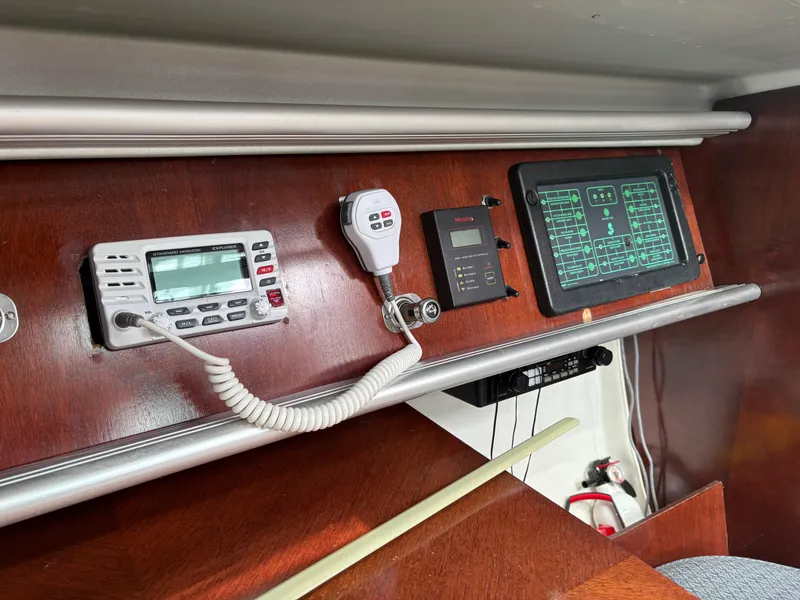 Slide: The Image of Control panel of a 1989 Beneteau 32s5 sailboat with radio and navigation equipment. - 35