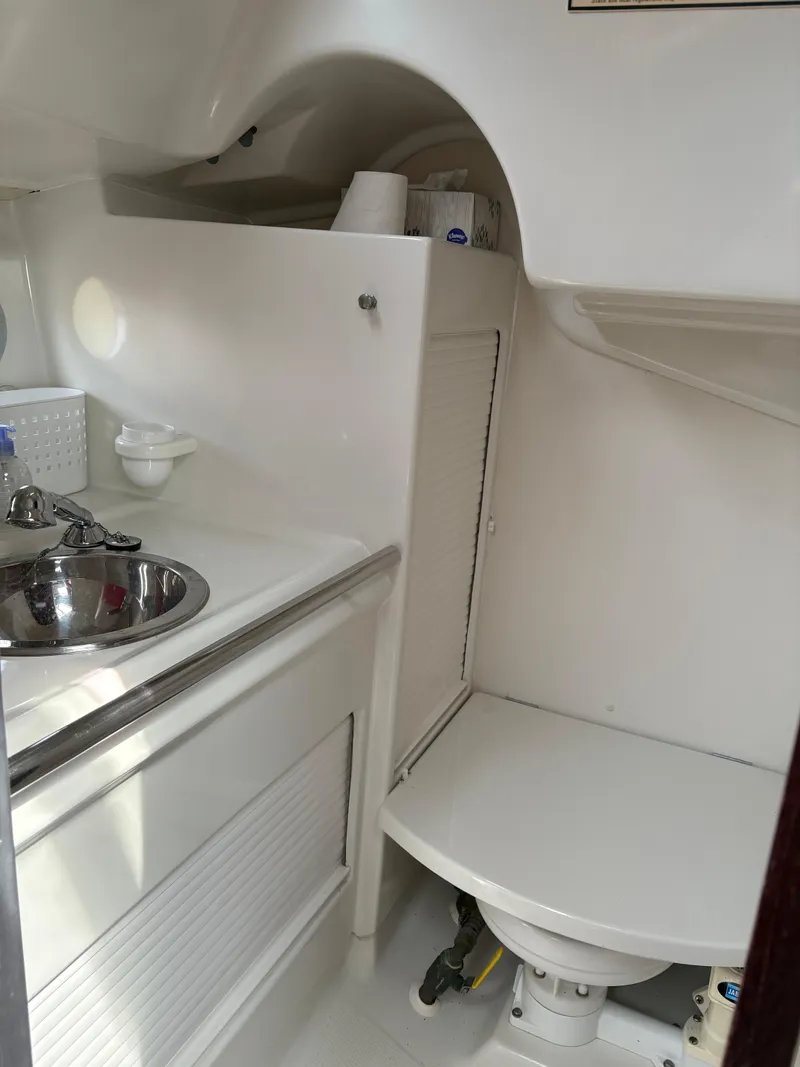Slide: The Image of Interior of 1989 Beneteau 32s5 yacht bathroom with sink and toilet. - 37