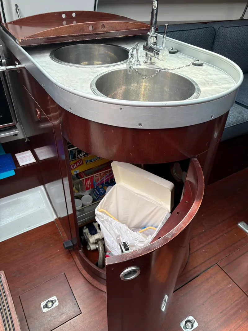 Slide: The Image of Galley of 1989 Beneteau 32s5 yacht with dual sinks and storage. - 39