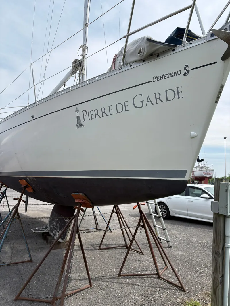 Slide: The Image of 1989 Beneteau 32s5 sailboat "Pierre de Garde" on stands in a boatyard. - 4