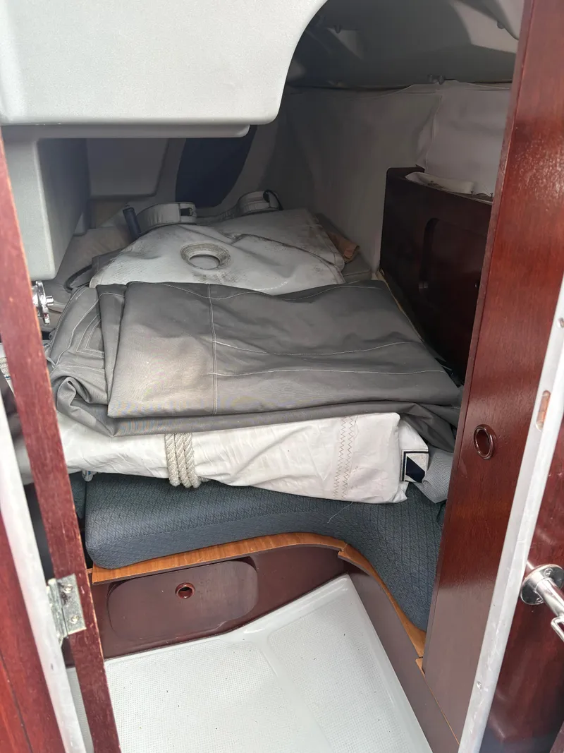 Slide: The Image of Interior cabin of a 1989 Beneteau 32s5 sailboat with folded sails. - 44