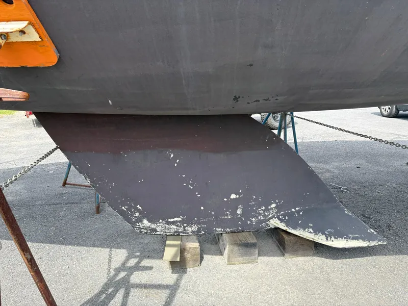 Slide: The Image of Keel of a 1989 Beneteau 32s5 sailboat on dry dock. - 6