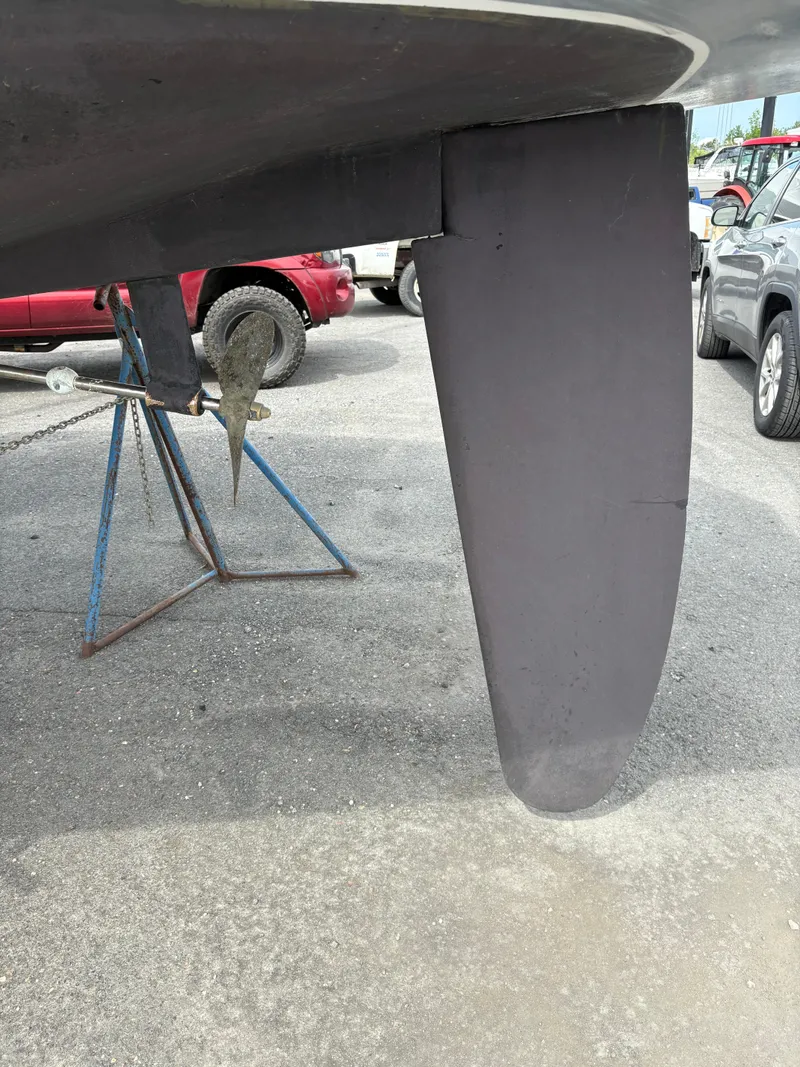 Slide: The Image of Rudder and propeller of a 1989 Beneteau 32s5 sailboat on a stand. - 8