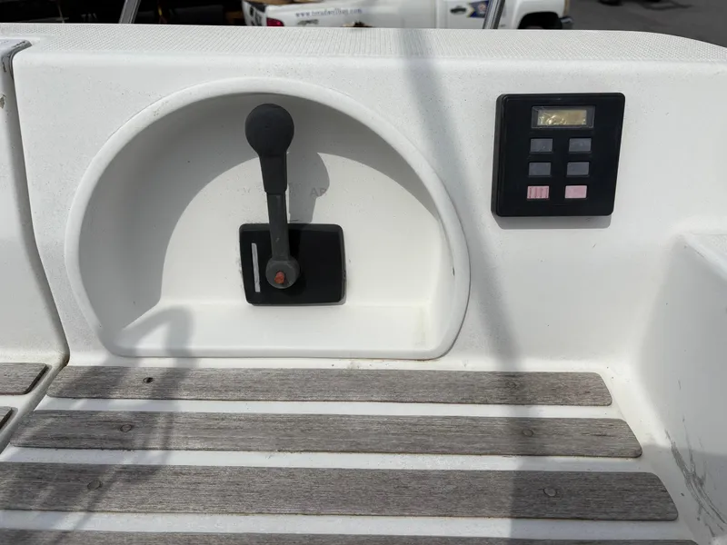 Slide: The Image of Control panel and throttle lever on a 1989 Beneteau 32s5 sailboat deck. - 12
