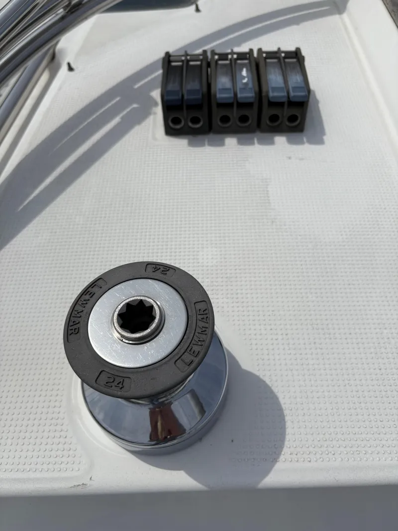 Slide: The Image of Winch and rope clutches on 1989 Beneteau 32s5 sailboat deck. - 15