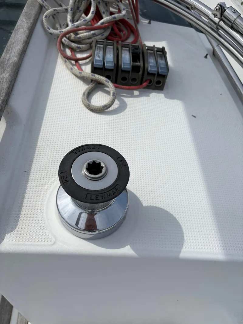 Slide: The Image of Winch and ropes on a 1989 Beneteau 32s5 sailboat deck. - 17