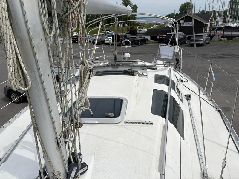 Slide: The Image of 1989 Beneteau 32s5 sailboat deck with rigging and docked surroundings. - 22