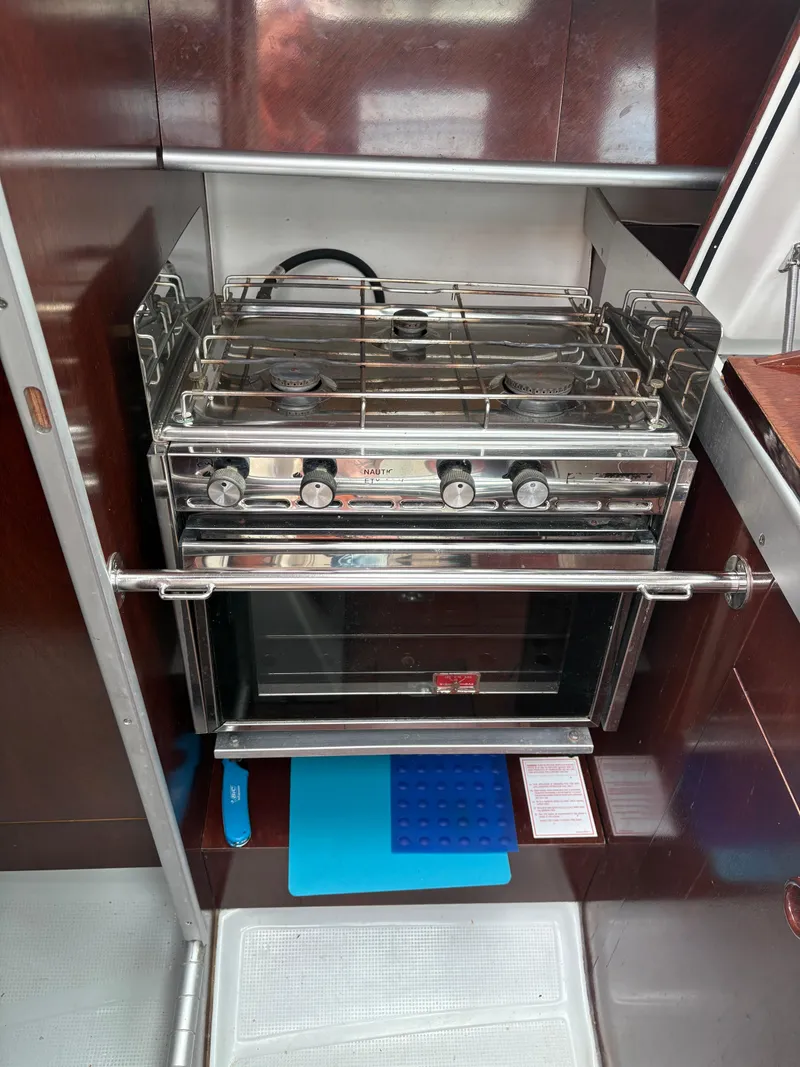 Slide: The Image of Galley kitchen in 1989 Beneteau 32s5 sailboat with stove and oven. - 43