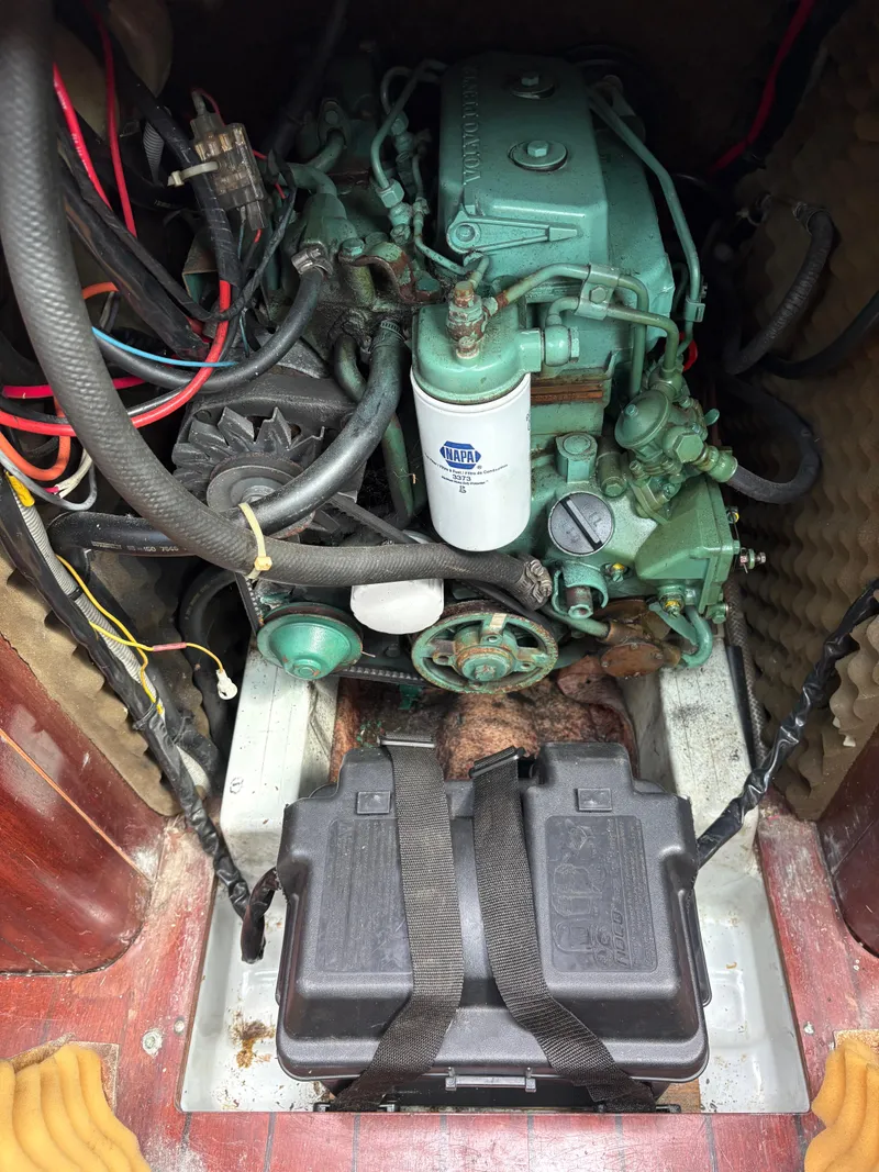 Slide: The Image of Engine compartment of a 1989 Beneteau 32s5 sailboat, featuring a Volvo Penta engine. - 46