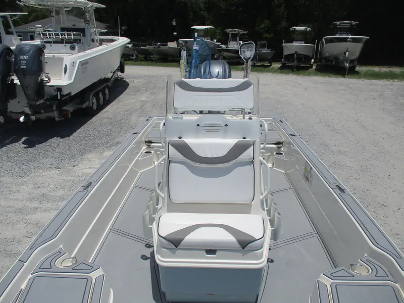 Slide: The Image of 2023 Skeeter SX 240 boat with seating, parked on gravel lot. - 10
