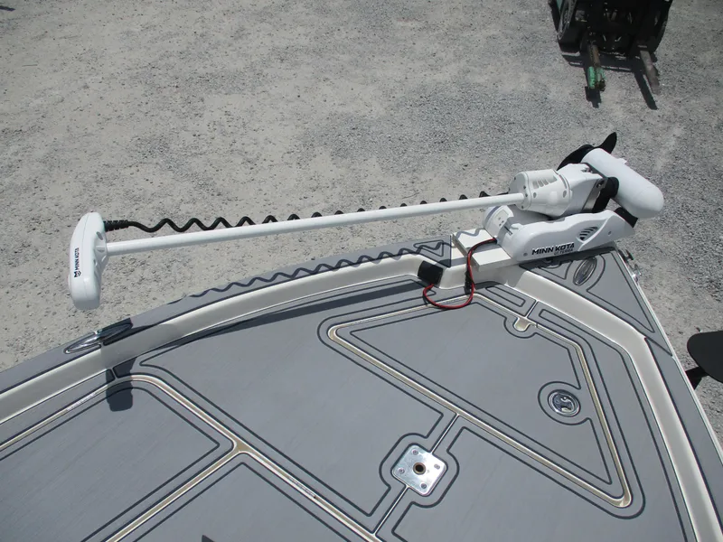 Slide: The Image of 2023 Skeeter SX 240 boat with Minn Kota trolling motor on deck. - 18