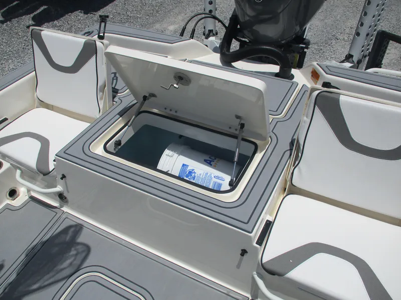 Slide: The Image of 2023 Skeeter SX 240 boat interior with open storage compartment and seating. - 9