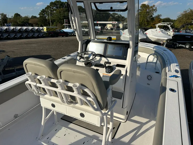 Slide: The Image of 2025 Sportsman Open 232 Center Console boat with dual seats and modern dashboard. - 10