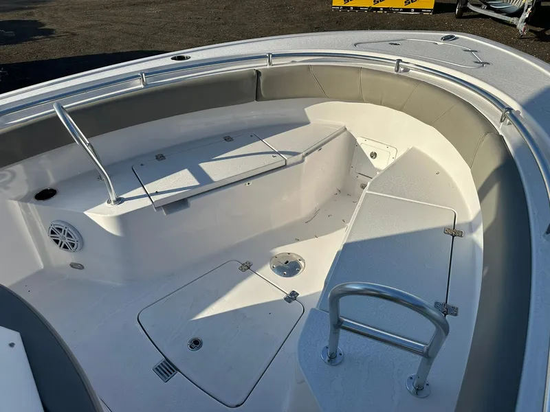 Slide: The Image of 2025 Sportsman Open 232 Center Console boat interior with seating and storage compartments. - 19