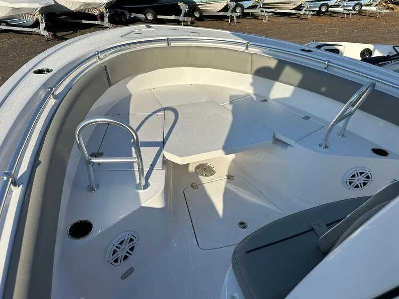 Slide: The Image of 2025 Sportsman Open 232 Center Console boat interior with seating and storage compartments. - 20