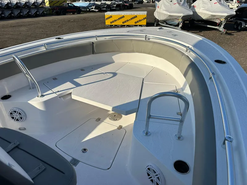 Slide: The Image of 2025 Sportsman Open 232 Center Console boat interior with seating and storage compartments. - 21
