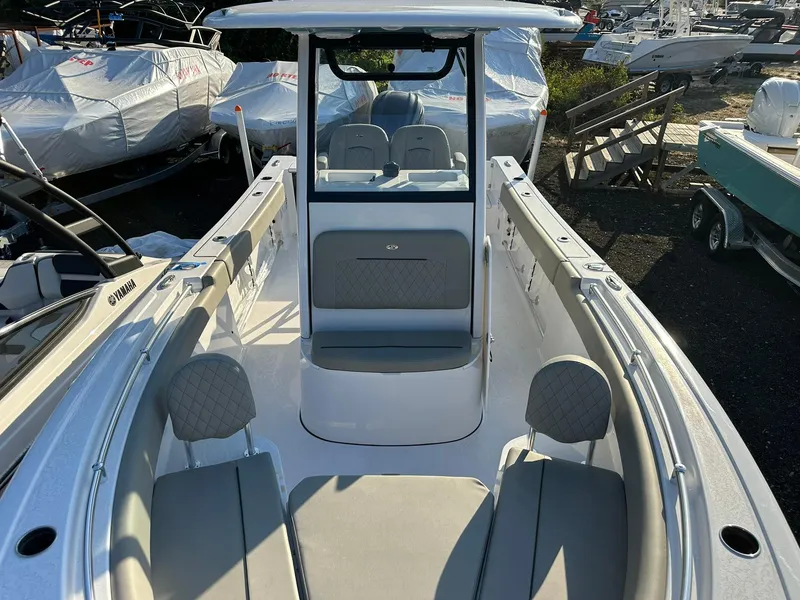 Slide: The Image of 2025 Sportsman Open 232 Center Console boat interior with seating and console view. - 26