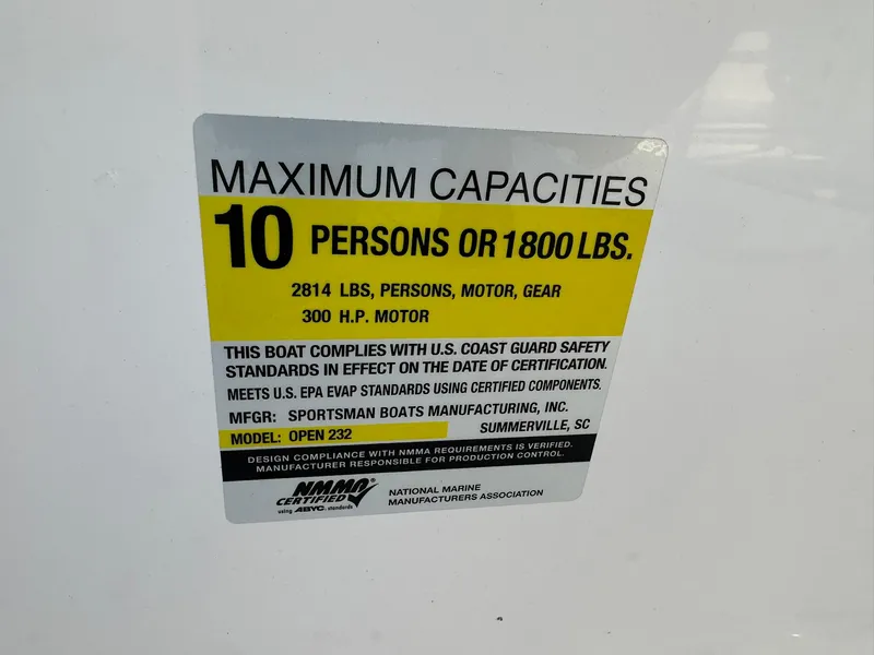 Slide: The Image of Capacity label for 2025 Sportsman Open 232 Center Console, max 10 persons or 1800 lbs. - 27