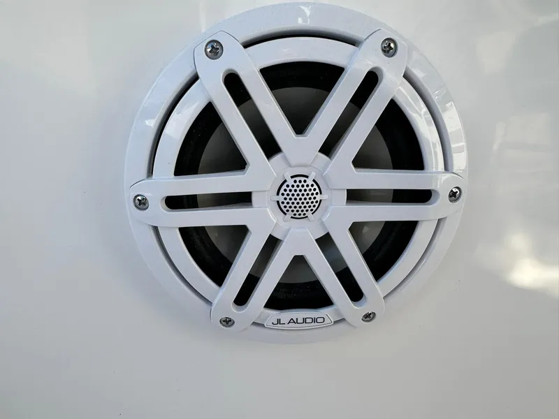 Slide: The Image of White JL Audio speaker on 2025 Sportsman Open 232 Center Console boat. - 28