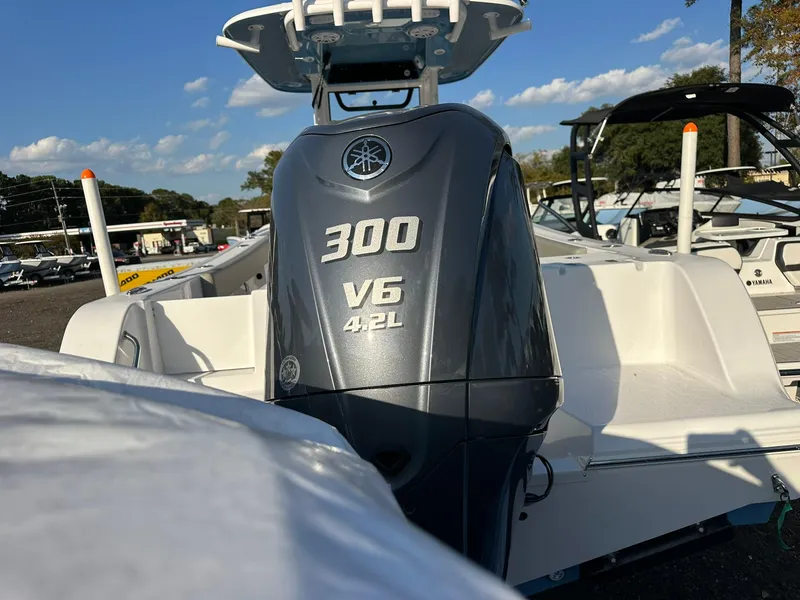 Slide: The Image of 2025 Sportsman Open 232 Center Console with 300 V6 4.2L engine, outdoor display. - 7