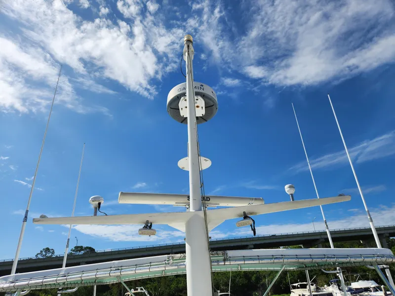 Slide: The Image of Radar and antennas on a 1979 Hatteras 58 Long Range Cruiser under a blue sky. - 37