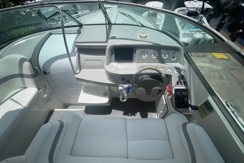 Slide: The Image of Cockpit of 2000 Formula 330 SS boat with steering wheel and control panel. - 18