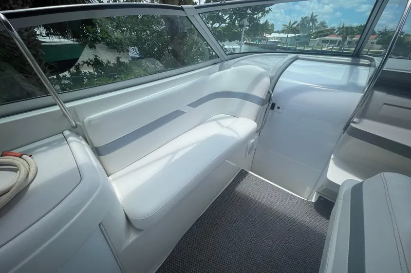Slide: The Image of Interior of a 2000 Formula 330 SS boat with white seating and sleek design. - 20