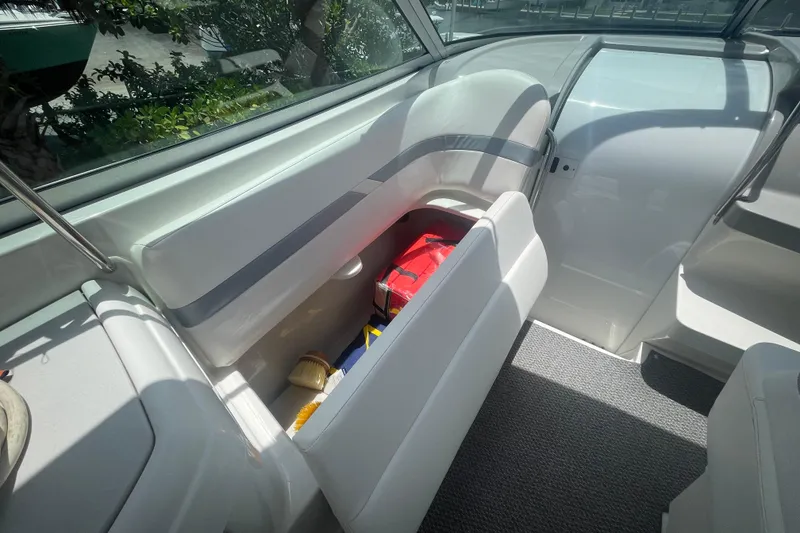Slide: The Image of Interior of a 2000 Formula 330 SS boat with open storage compartment. - 21