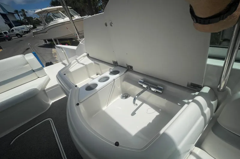 Slide: The Image of 2000 Formula 330 SS boat interior with sink and cup holders. - 27