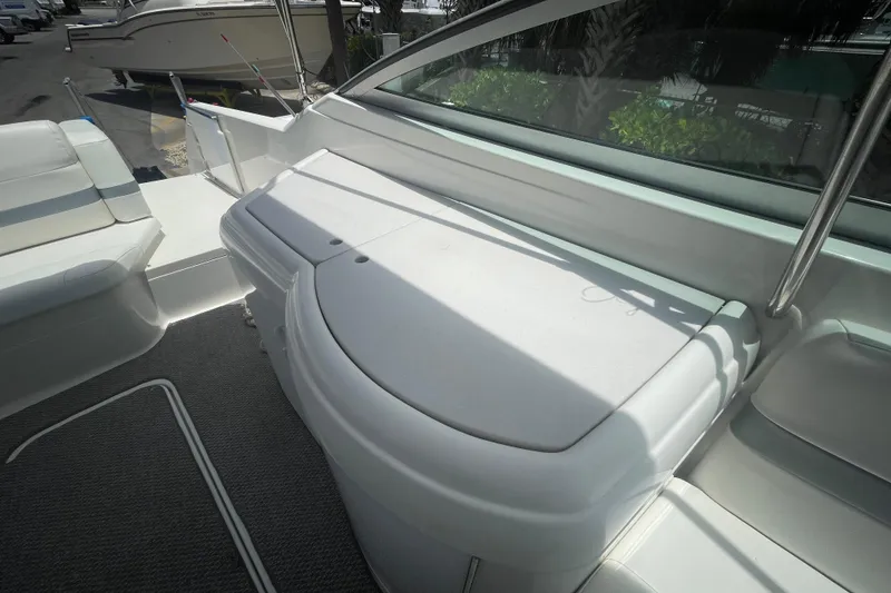 Slide: The Image of 2000 Formula 330 SS boat interior with white seating and sleek design. - 28