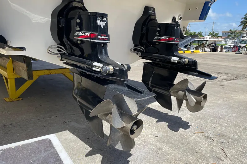 Slide: The Image of Dual Mercury MerCruiser outdrives on a 2000 Formula 330 SS boat, dockside view. - 4