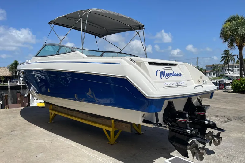 Slide: The Image of 2000 Formula 330 SS boat with blue hull, docked in Fort Lauderdale. - 5