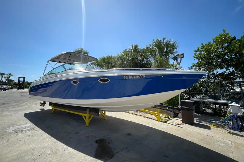 Slide: The Image of 2000 Formula 330 SS boat on trailer under clear blue sky. - 7