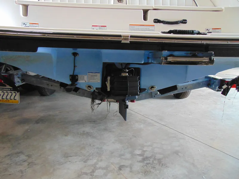 Slide: The Image of Rear view of a 2024 Yamaha 190 FSH Sport boat on a trailer. - 14