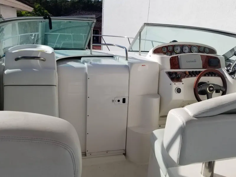 Slide: The Image of 2000 Wellcraft 3000 Martinique boat interior with steering wheel and dashboard controls. - 3