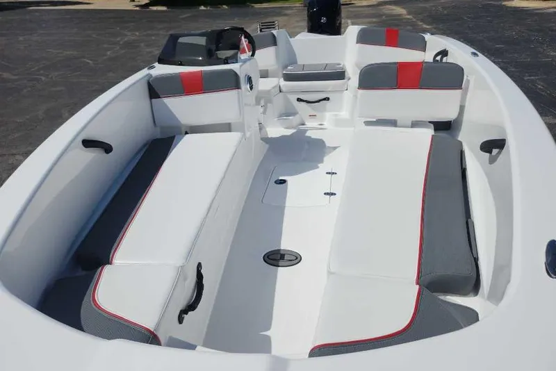 Slide: The Image of 2025 Tahoe T18 boat interior with white and red seating, spacious layout. - 3
