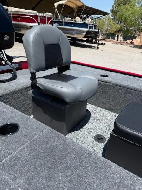Slide: The Image of 2025 Tracker Panfish 17 boat seat with gray upholstery, set in a carpeted deck. - 9