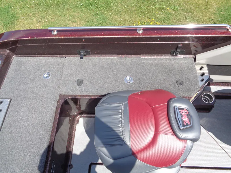Slide: The Image of 2022 Ranger 621 FS PRO boat interior with red and gray seating, carpeted deck. - 12