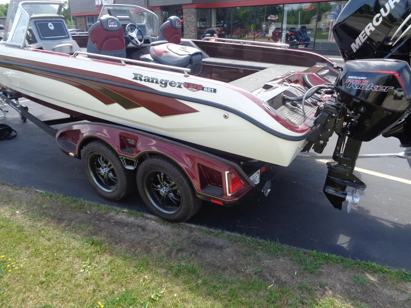 Slide: The Image of 2022 Ranger 621 FS PRO boat with Mercury Pro Kicker motor on a trailer. - 14