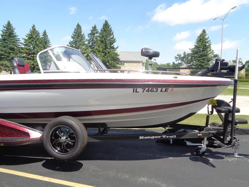 Slide: The Image of 2022 Ranger 621 FS PRO boat on trailer, parked outdoors, sunny day. - 20