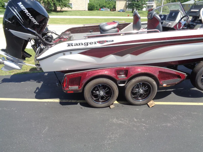 Slide: The Image of 2022 Ranger 621 FS PRO boat with Mercury engine on a triple-axle trailer. - 22